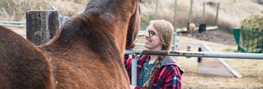 student with horse