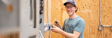 student wearing toolbelt