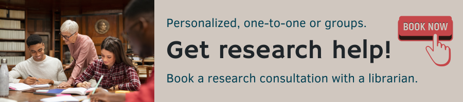 A group studying in a library next to text offering research help with a