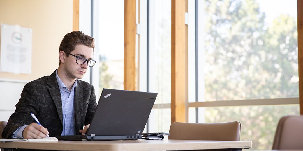 Man studying with laptop
