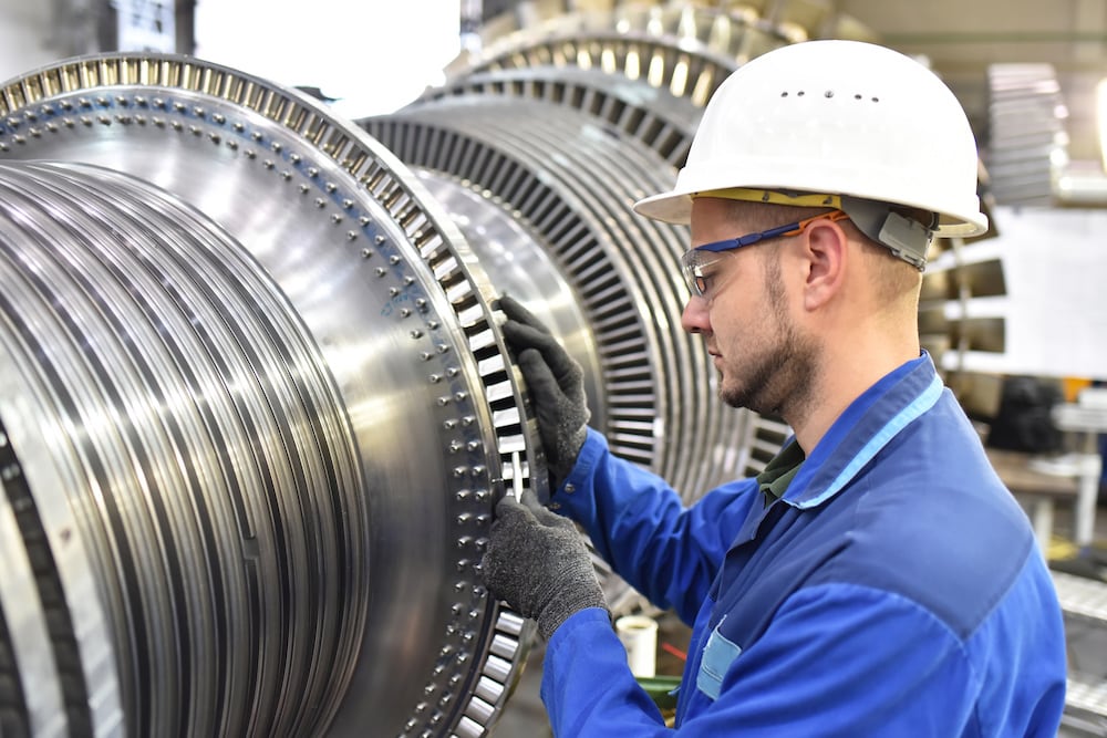 man working on turbine