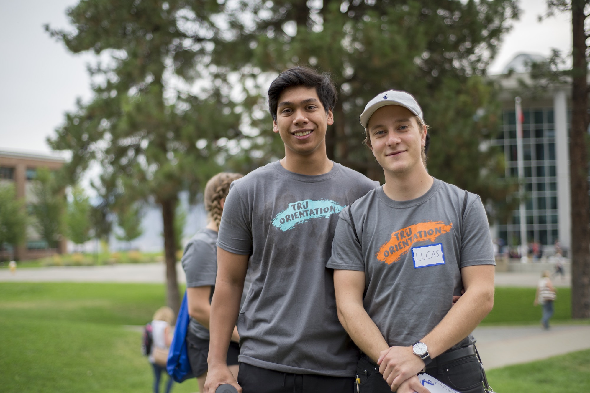 Two male mentors standing side by side
