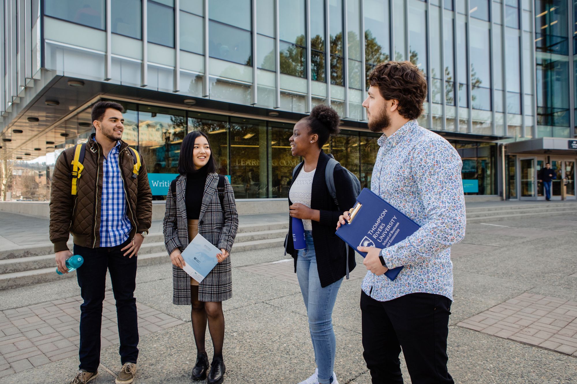 President Airini talking to member of the community.
