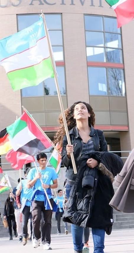 International students carrying flags
