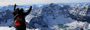 Student climbers celebrating ascent to top of mountain