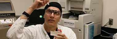 Student holding up test tube