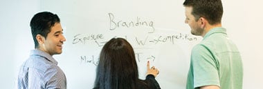students brainstorming on whiteboard