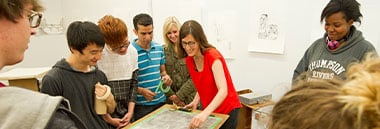 teacher and students in drawing class