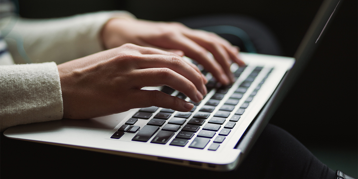 Person typing on laptop